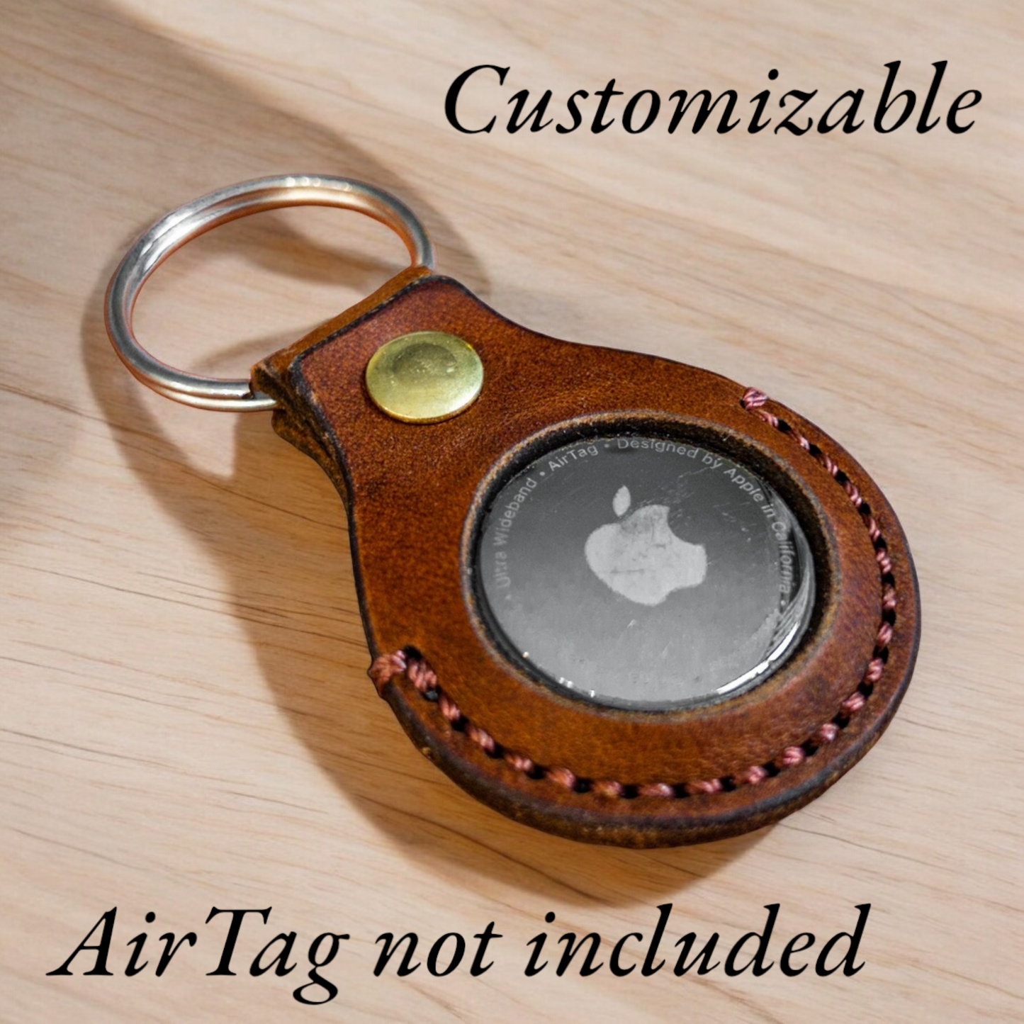 Customizable leather airtag holder with ring.
