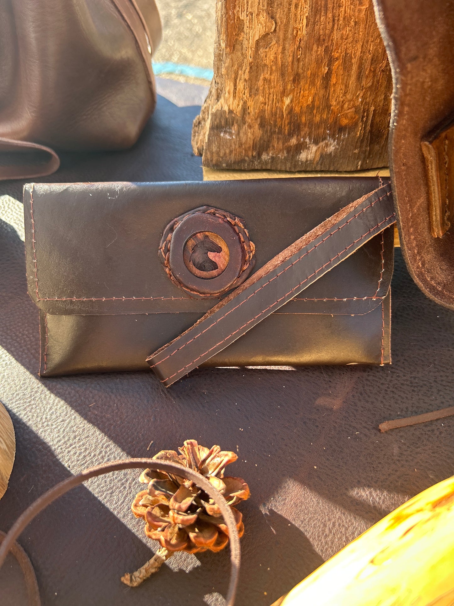 Leather clutch with wrist strap